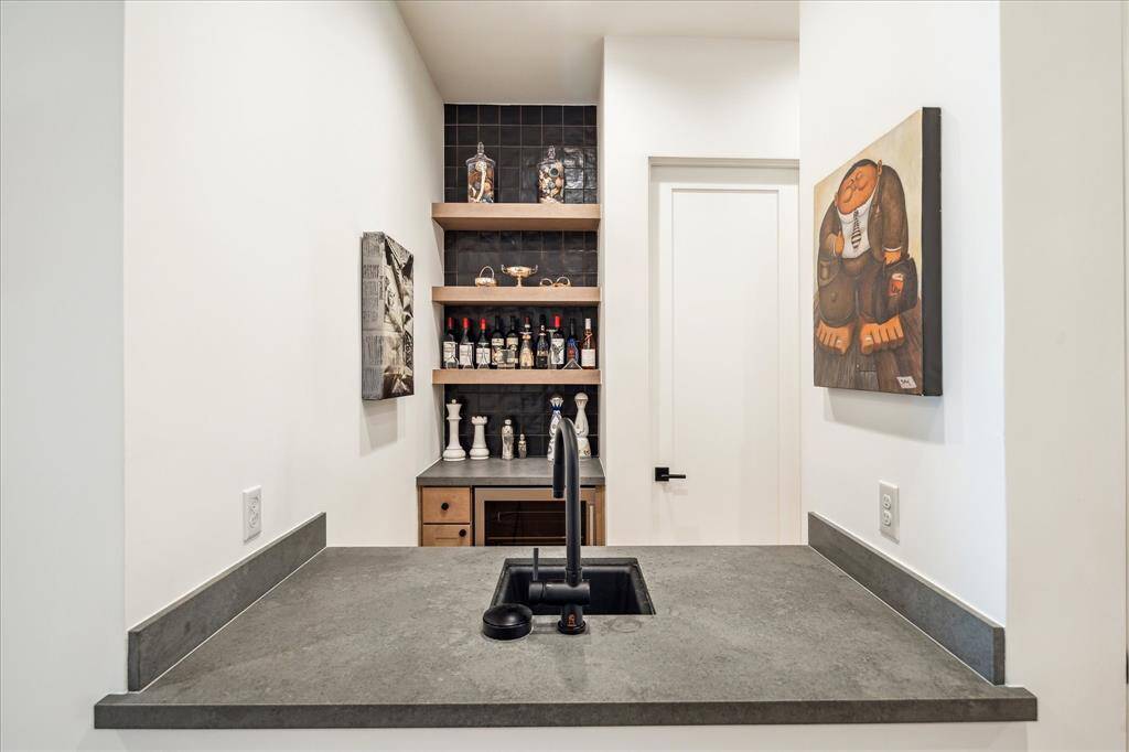 Wet bar has wine/bevergae cooler and built-in shelvs.