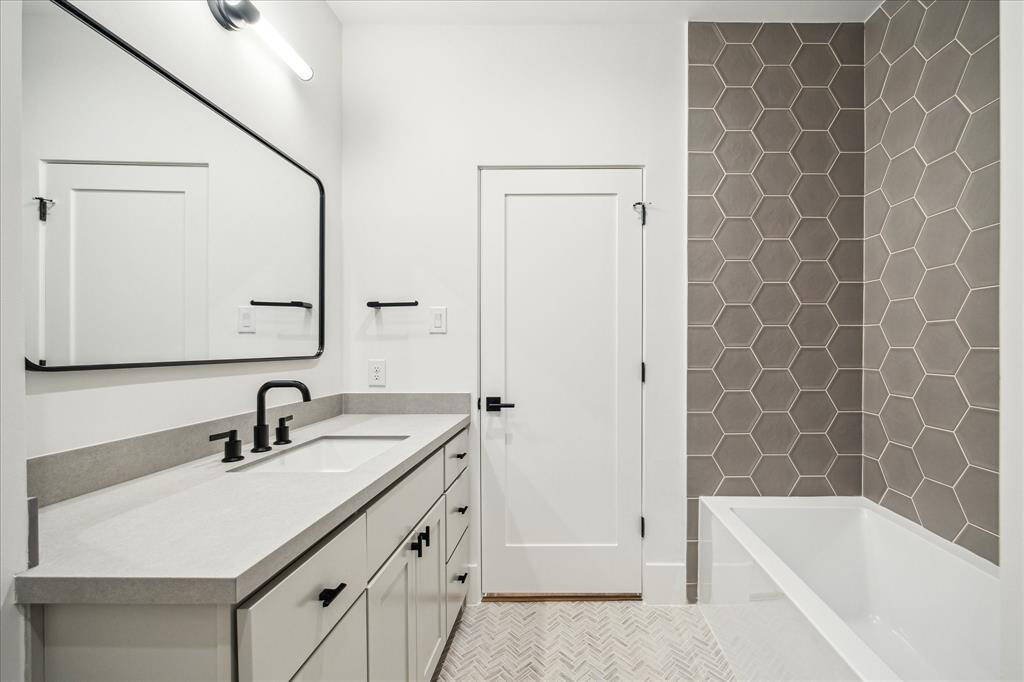 Second bath with shower/ tub combo.