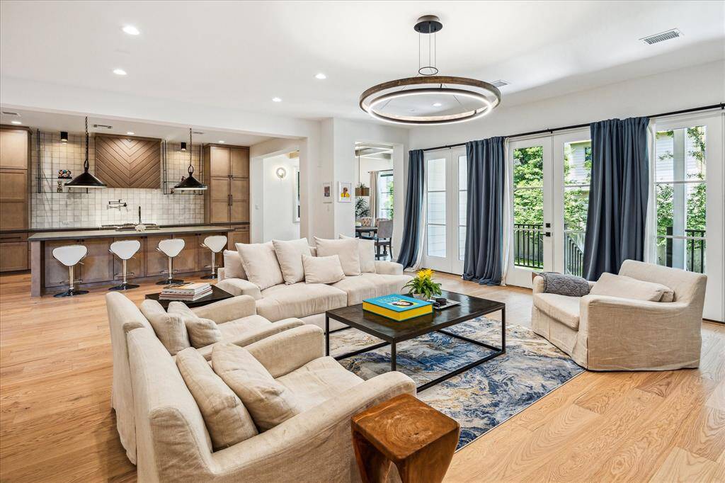 First floor expansive living room with double French door to the backyard.