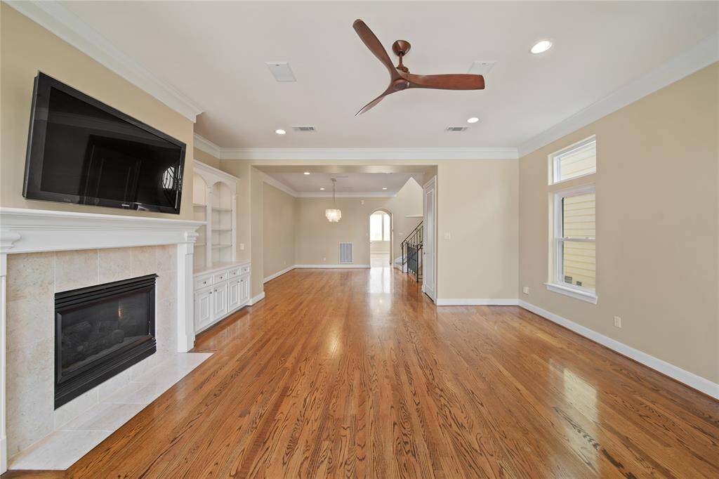 Experience culinary delight in a gourmet kitchen with a gas stove, sleek stainless steel appliances, and a convenient breakfast bar.