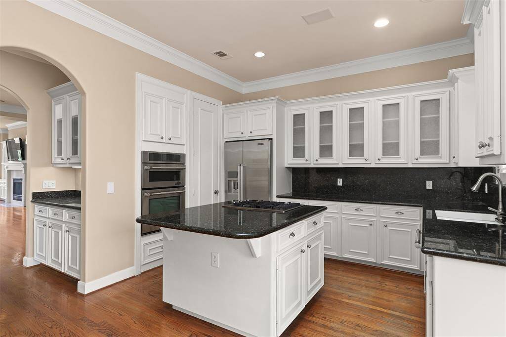 Enjoy seamless indoor-outdoor dining with a breakfast room opening to a BBQ-ready balcony.