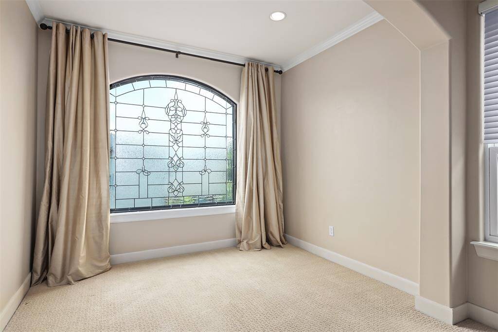 Experience comfort and elegance in the primary bedroom, featuring motorized shades and sound-dampening carpet.