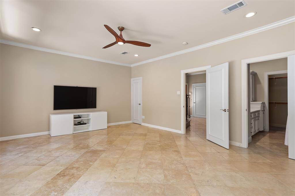 This versatile room can serve as either a large bedroom or a stylish den.