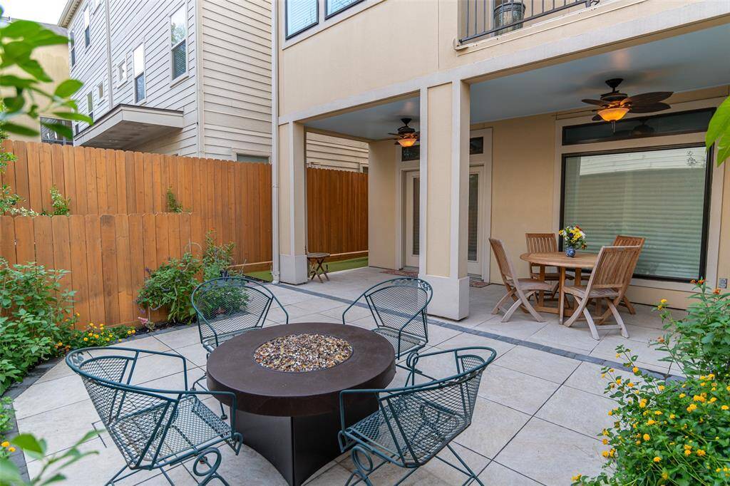 Enjoy seamless indoor-outdoor living with a first-floor bedroom/den opening to a private, fenced backyard featuring a gas-plumbed firepit