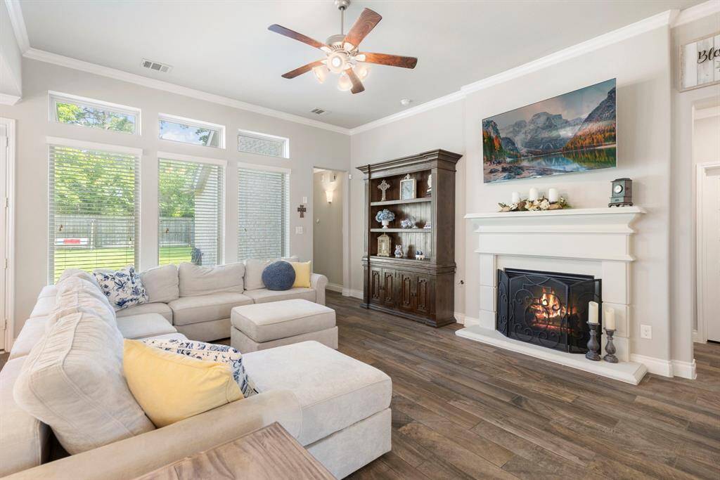 The living room offers a warm and inviting space, centered around a cozy fireplace.