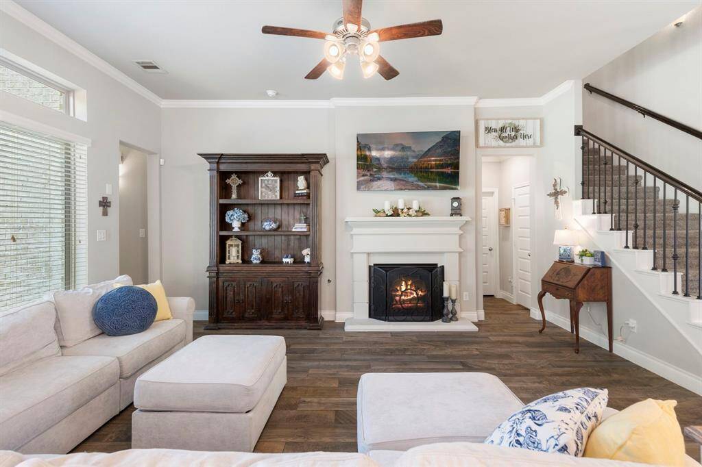 Unwind in the comfortable living room, where the warm fireplace creates the perfect spot to relax and recharge after a long day.