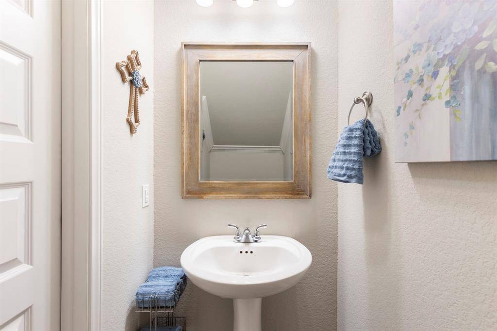The half bath is conveniently located near the living area, perfect for guest.