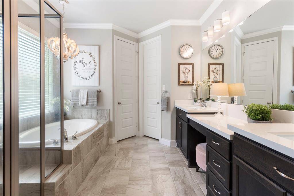 The primary bath showcases elegant features that create a spa-like retreat.