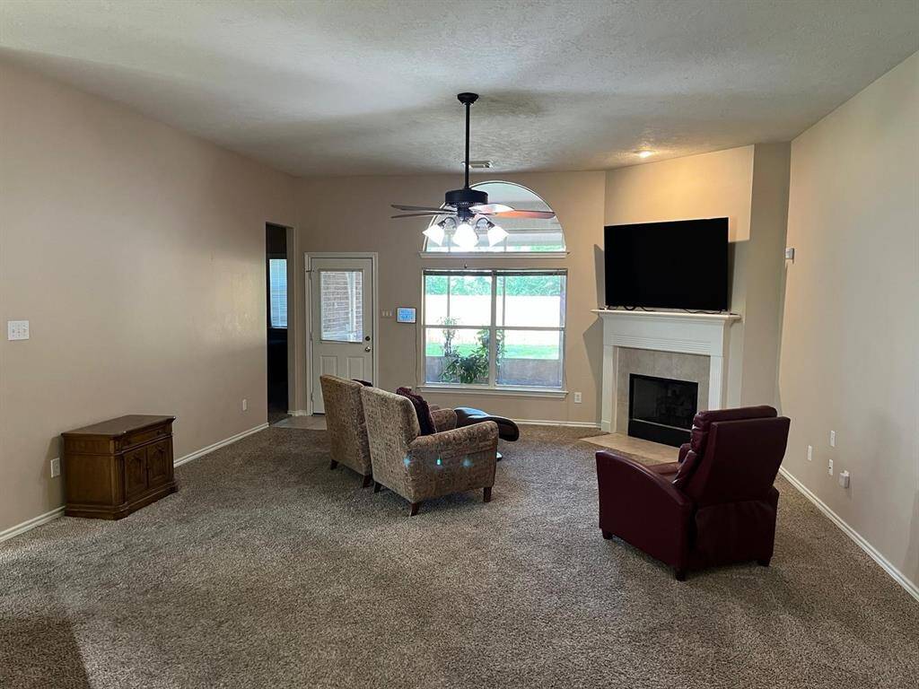 Spacious and Open Living Area with Gas Log Fireplace.