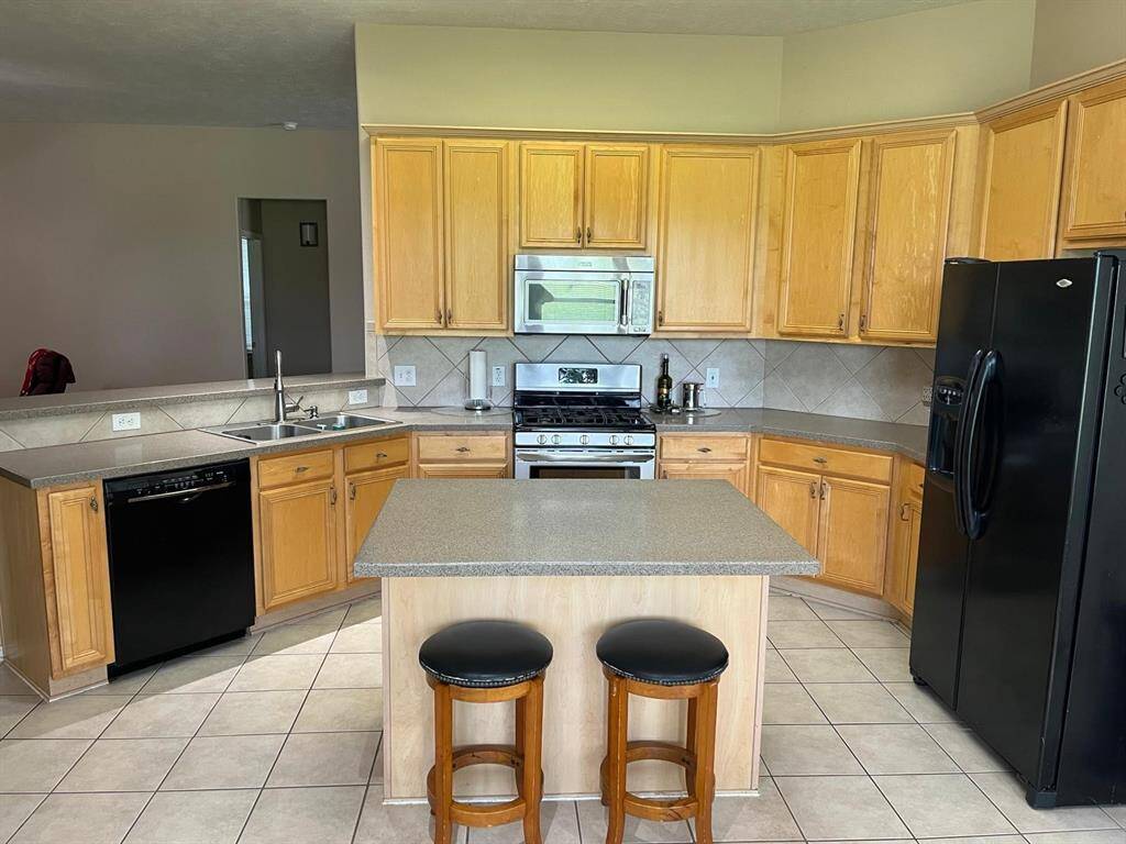 Open Island Kitchen with Breakfast Bar. Refrigerator Included!