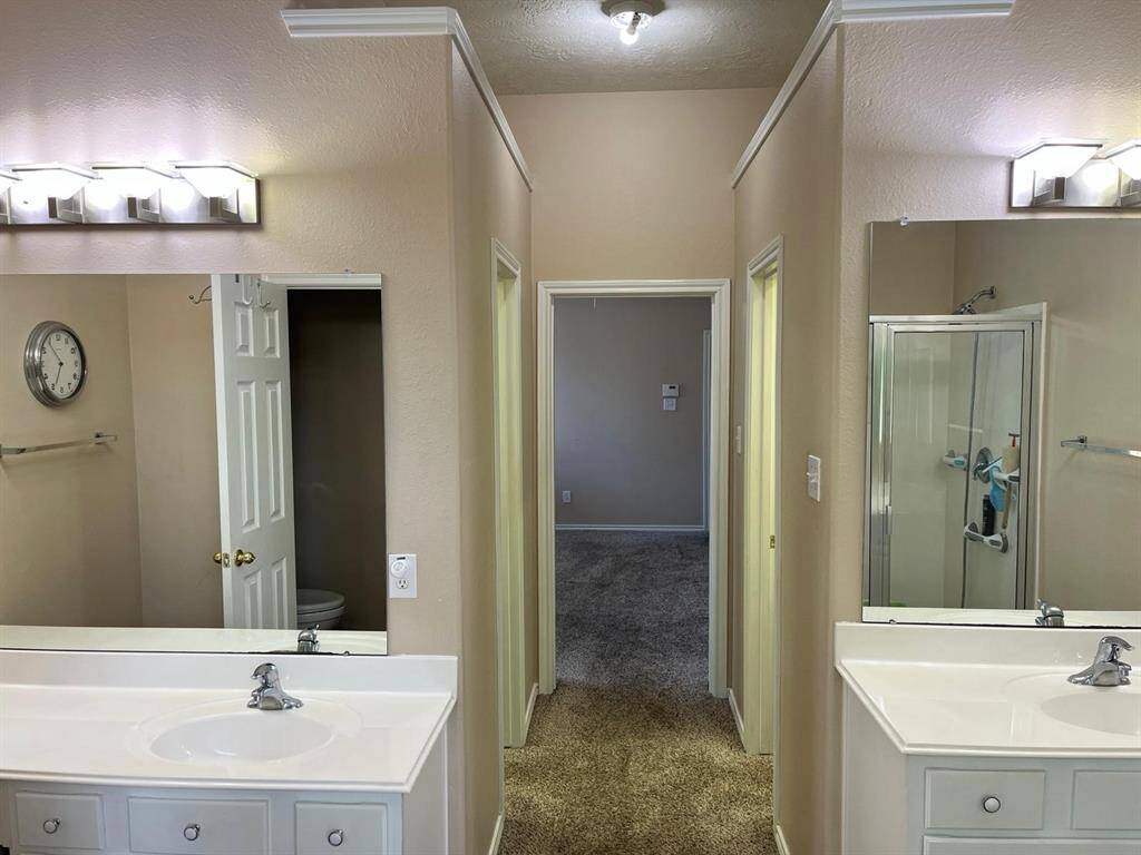 Dual Vanities and 2 Separate Closets.