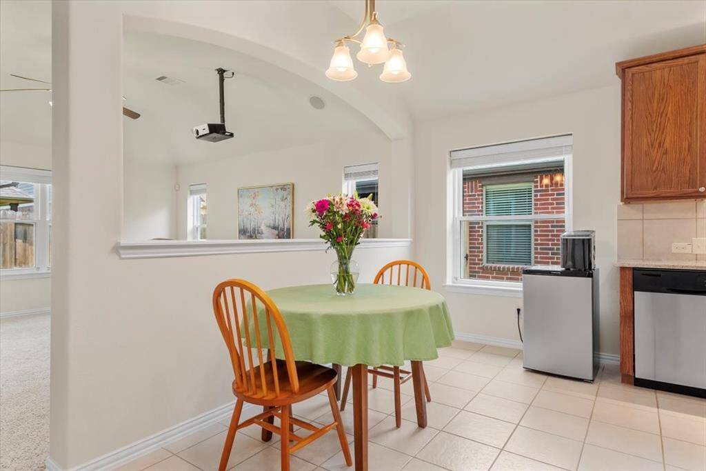 Tile floors extend from the entry into the kitchen and breakfast room. Here is a good photo of the recently upgraded double paned windows.