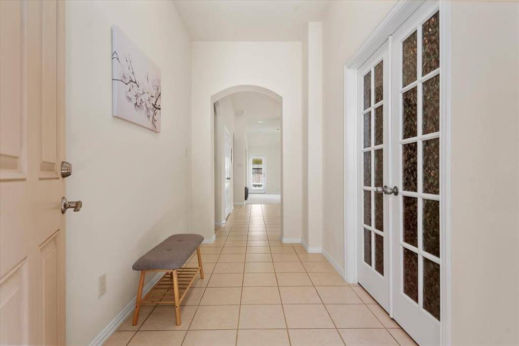 French dors lead to the study, arched doorway adds a touch of class.