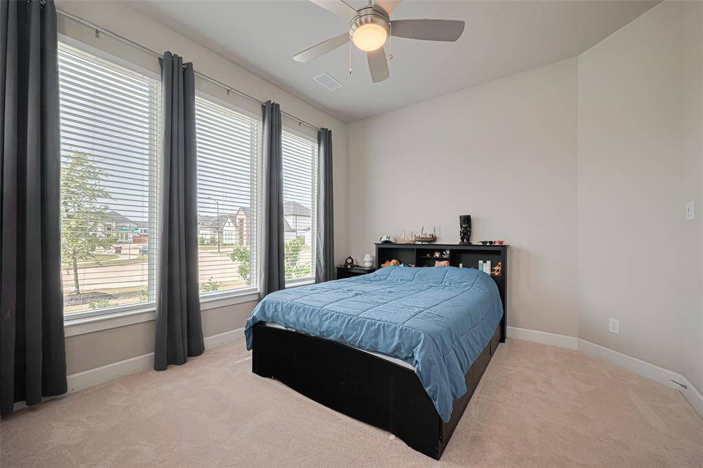This is an additional downstairs room is a multi-generational suite currently used as a bedroom.