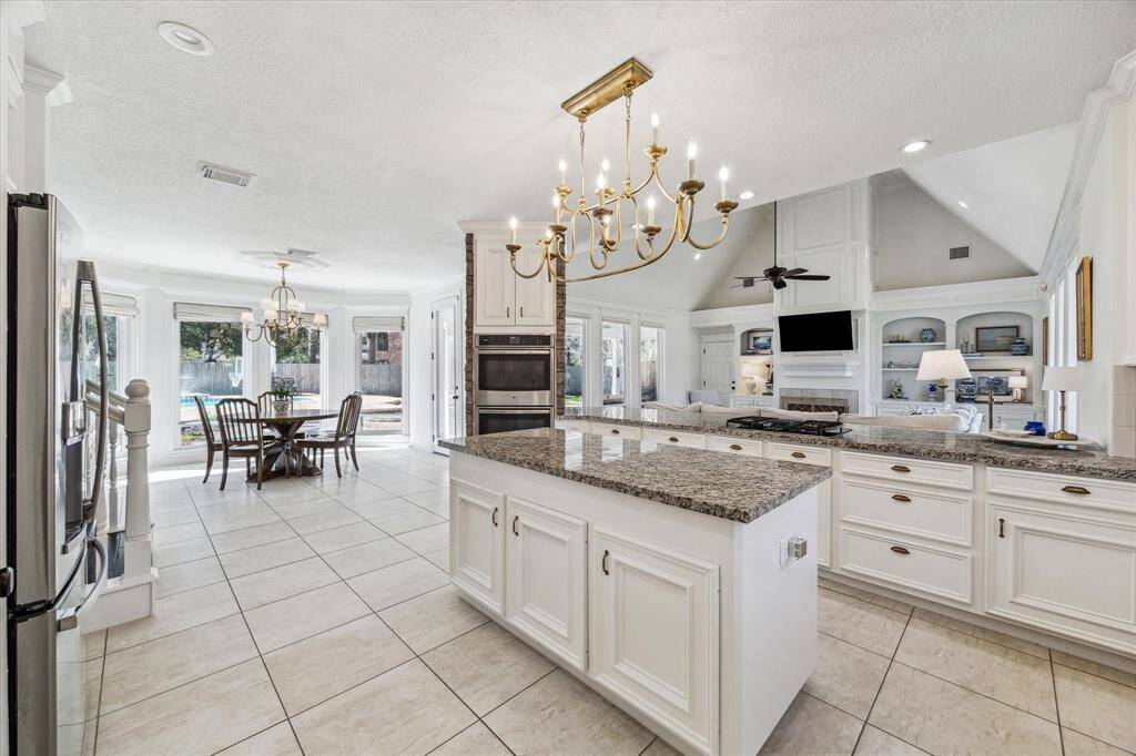 Look at the custom cabinets, all new hardware, newly painted, new lighting all open the the family room.