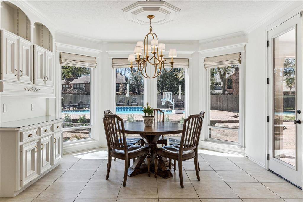 Look at the beautiful windows that overlook the pool.  Notice the blinds that are all remote controlled for ease.