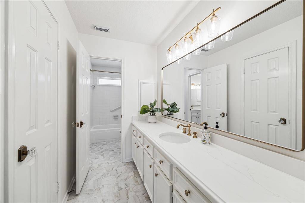 Lots of counter space in this stunning secondary bath.  Note all the new features.