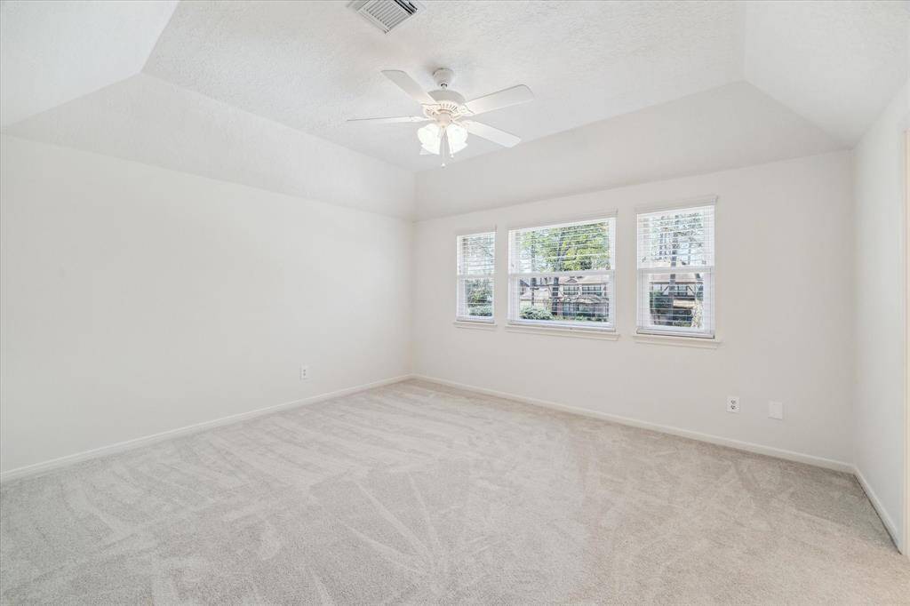 One of the secondary bedrooms upstairs.  All of the bedrooms have huge walk in closets.