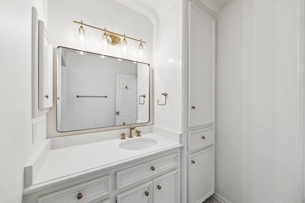 Another secondary bathroom with new hardware, fixtures, mirror and that clean, fresh look.