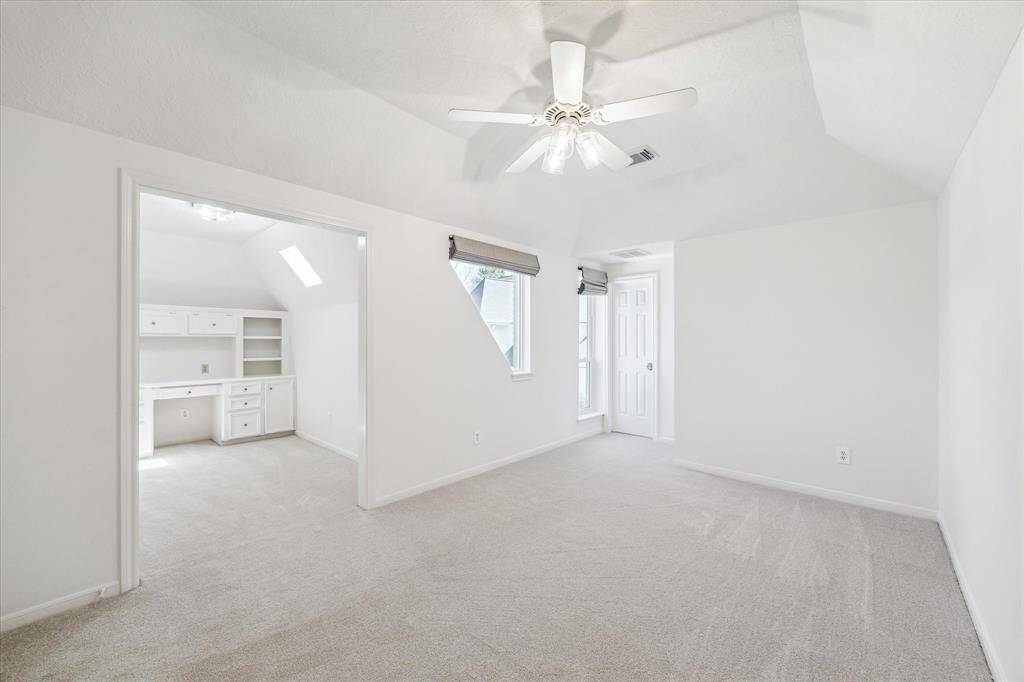 Another large secondary bedroom upstairs with a private homework/ study area.