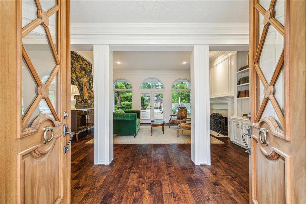 Enter through the custom double doors designed by the sellers.