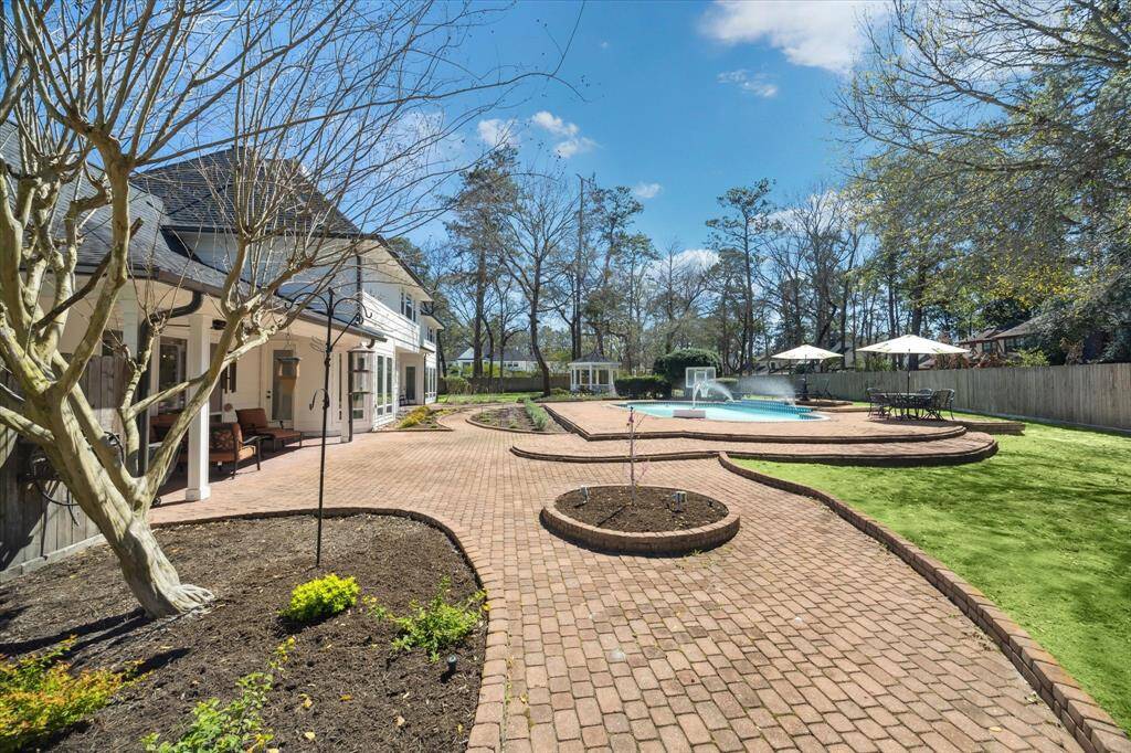 Beautiful pavers lead you to the pool, both patios and the sitting areas.