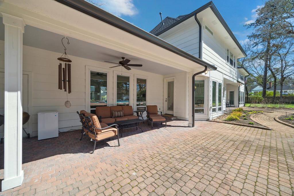 One of the Two covered patios to sit out and enjoy the pool area and yard.