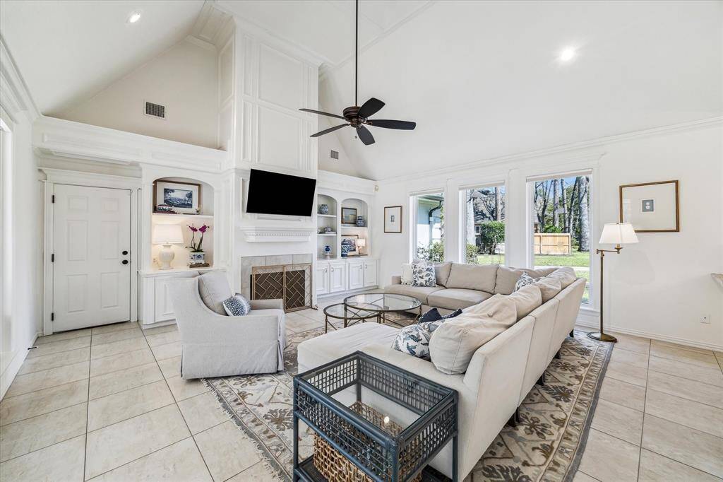 Stunning Family area with lots of natural light from both sides.  Note the cathedral ceilings and remote blinds.