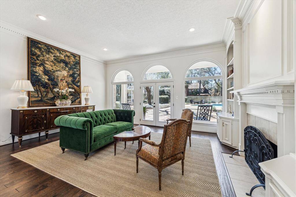 Just look at this beautiful room greeting your guest.  It offers high ceilings, a gorgeous fireplace and double doors to go out to the 1 of the 2 covered patios.  This home is perfect for entertaining friends and family.