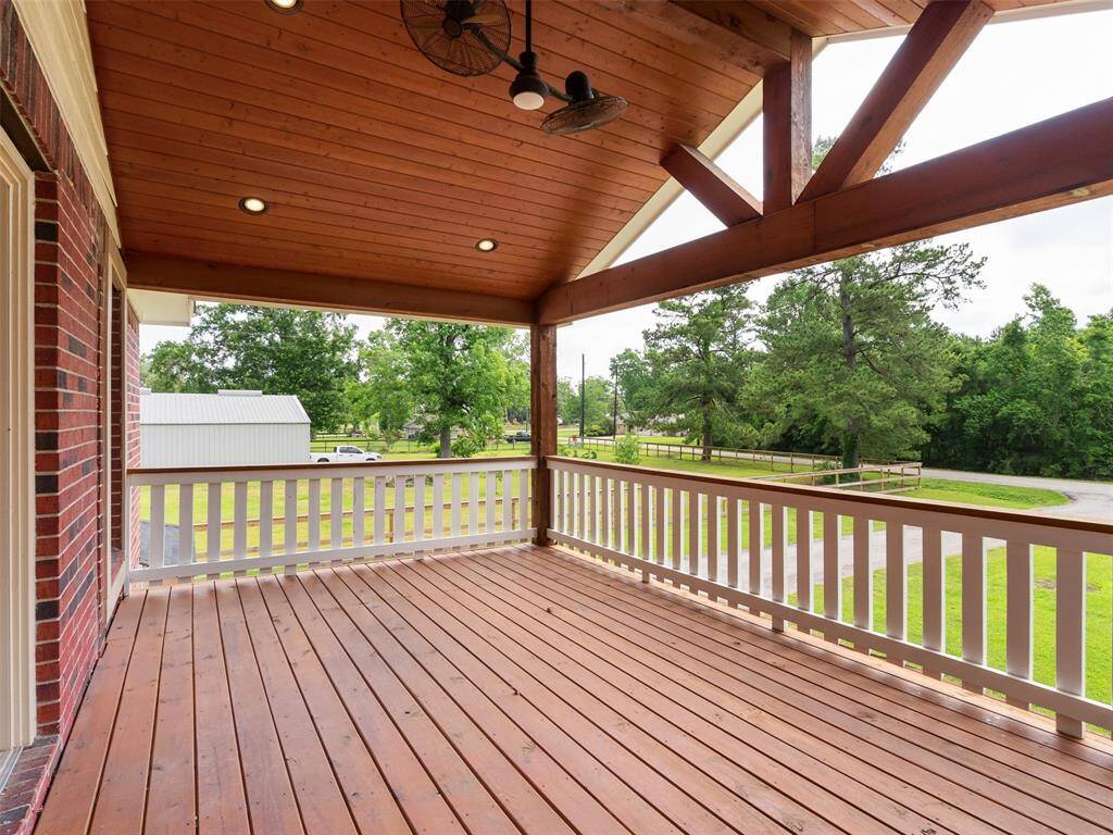 Covered Deck off the Primary that overlooks the property.