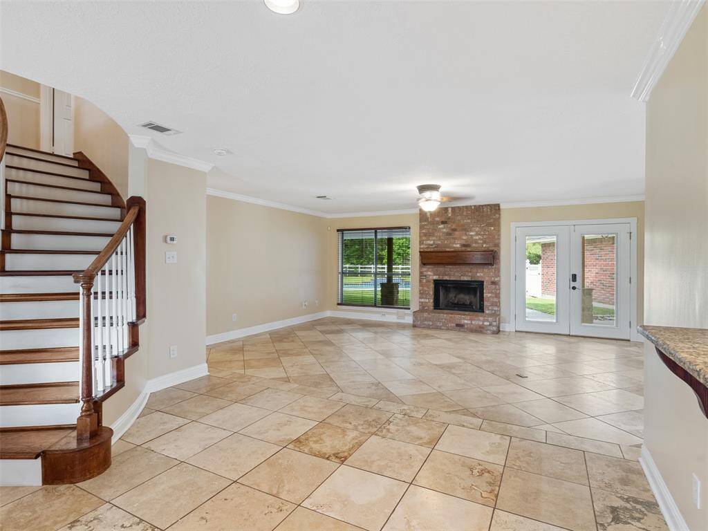 Sit at the kitchen bar and over see the living area