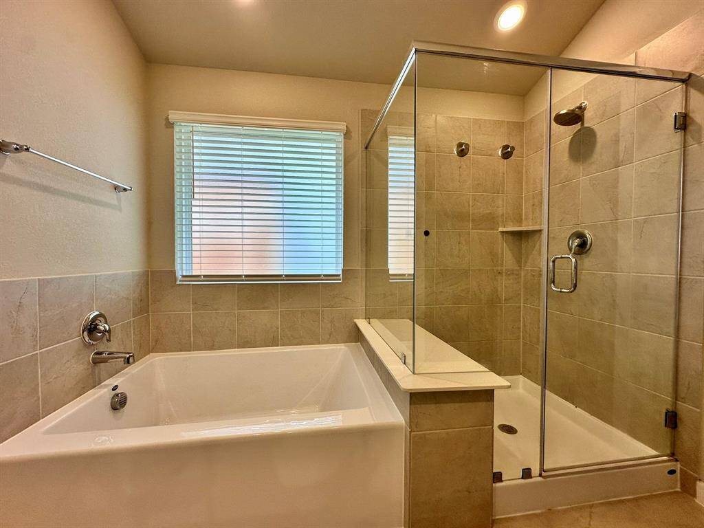 Large soaking tub with walk in shower.