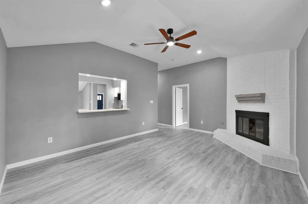 Another view of family room with open window space to connect with kitchen