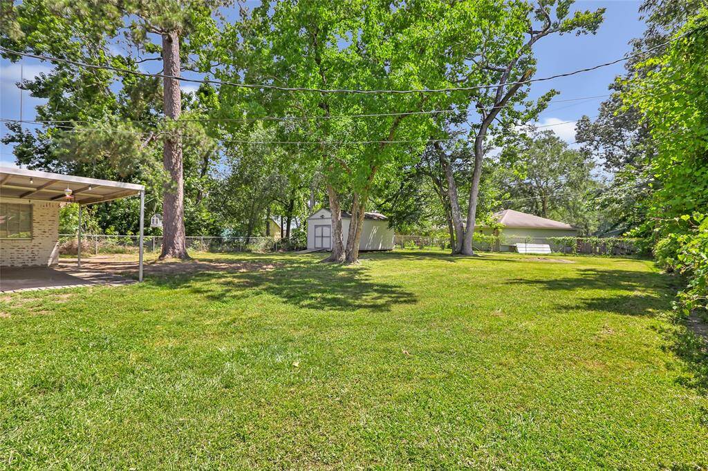Large fenced backyard with 12x24 storage shed with loft/60amp service