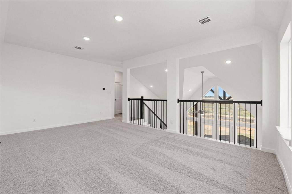 Large open gameroom with balcony view of downstairs