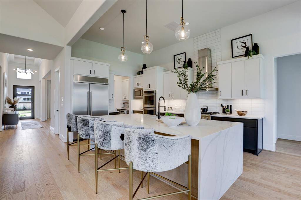 Kitchen showcasing tons of upgrades and the luxurious craftsmanship of the Marble Island.