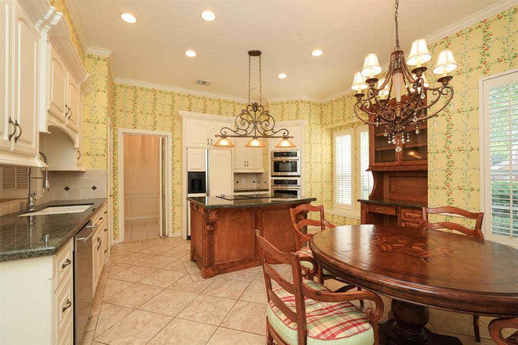 Gather around for casual dining in this inviting space, where cherished family memories are made. Relish the serenity and seclusion of your backyard, enhanced by the absence of rear neighbors, creating a peaceful haven for relaxation and enjoyment.