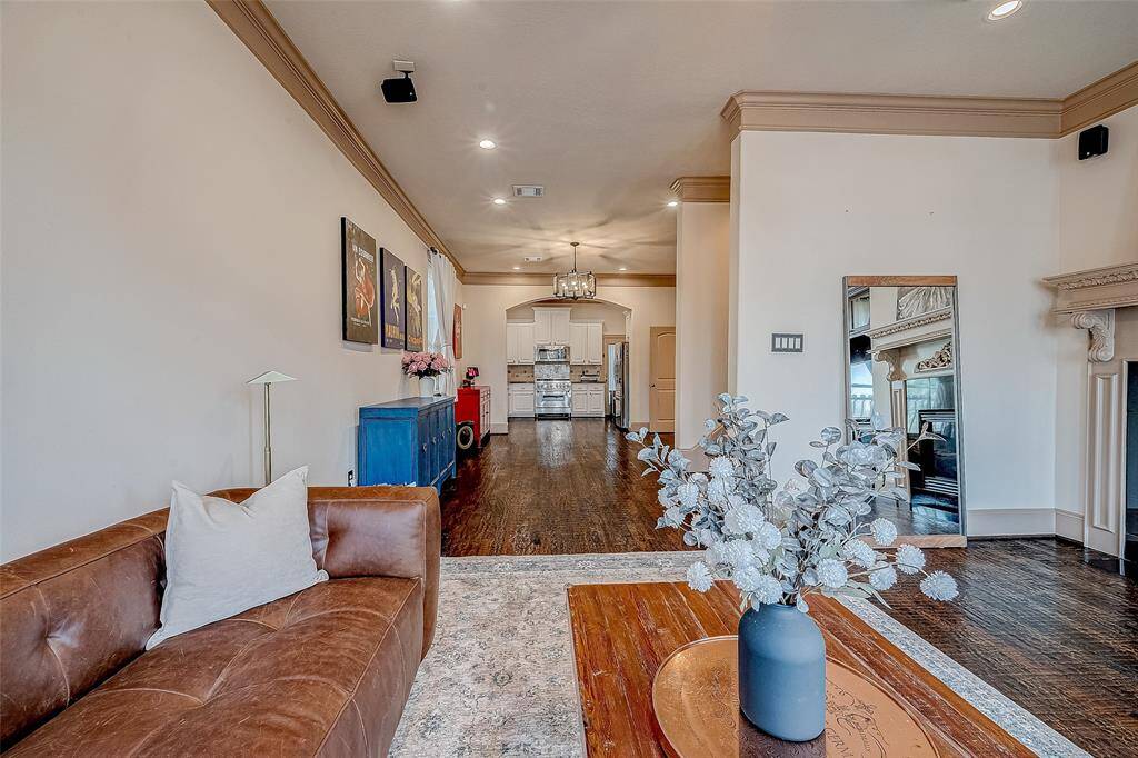A spacious, open layout seamlessly connects the living room to the dining area and kitchen, enhancing flow and functionality.