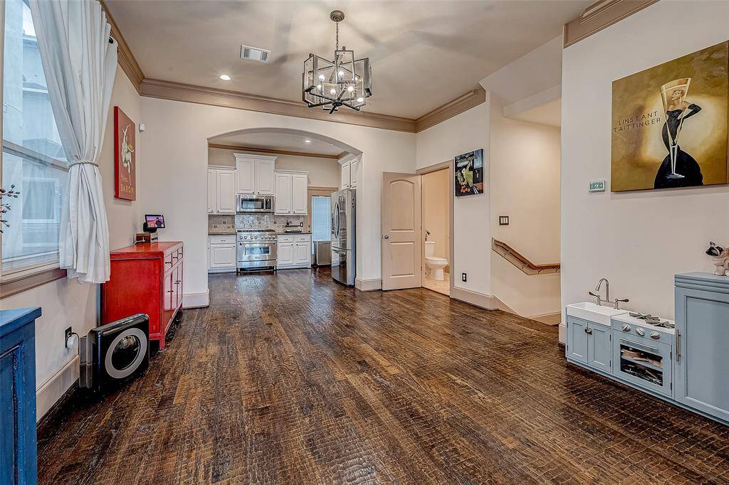 Spacious and airy, the dining room offers an open layout with ample natural light, perfect for gatherings.