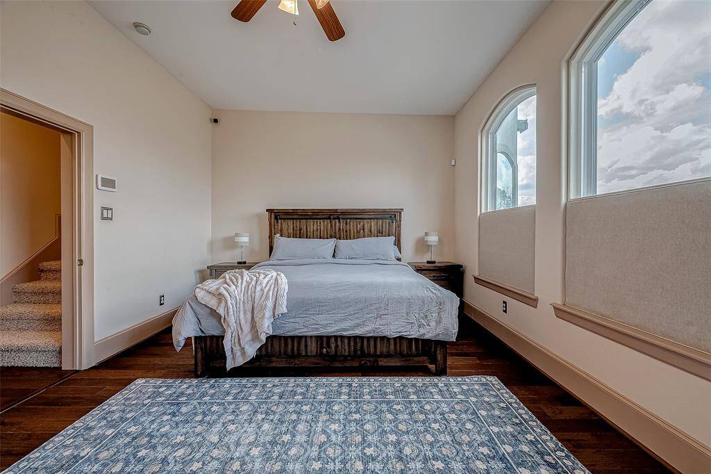 Spacious primary bedroom, offering plenty of room for comfort and style.