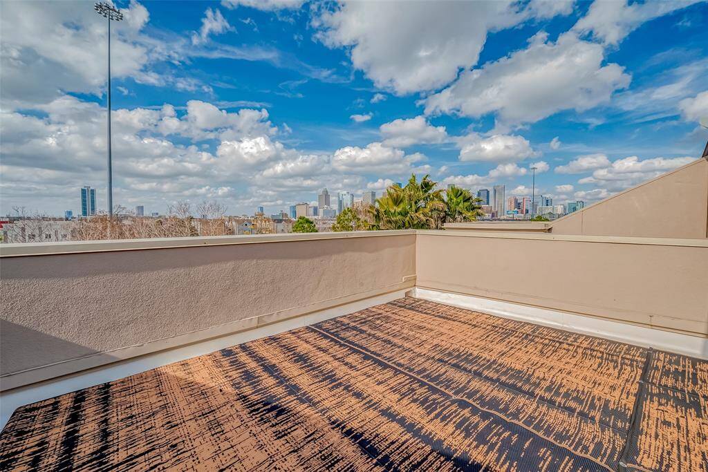 Spacious rooftop terrace with panoramic city views, perfect for relaxation or entertaining.