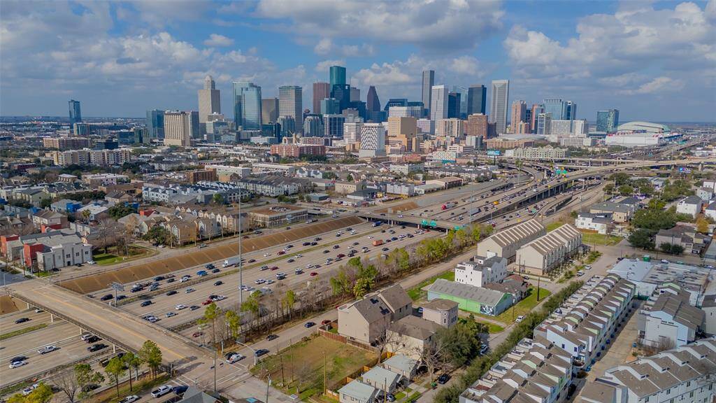 This aerial photo shows a vibrant cityscape with modern skyscrapers.