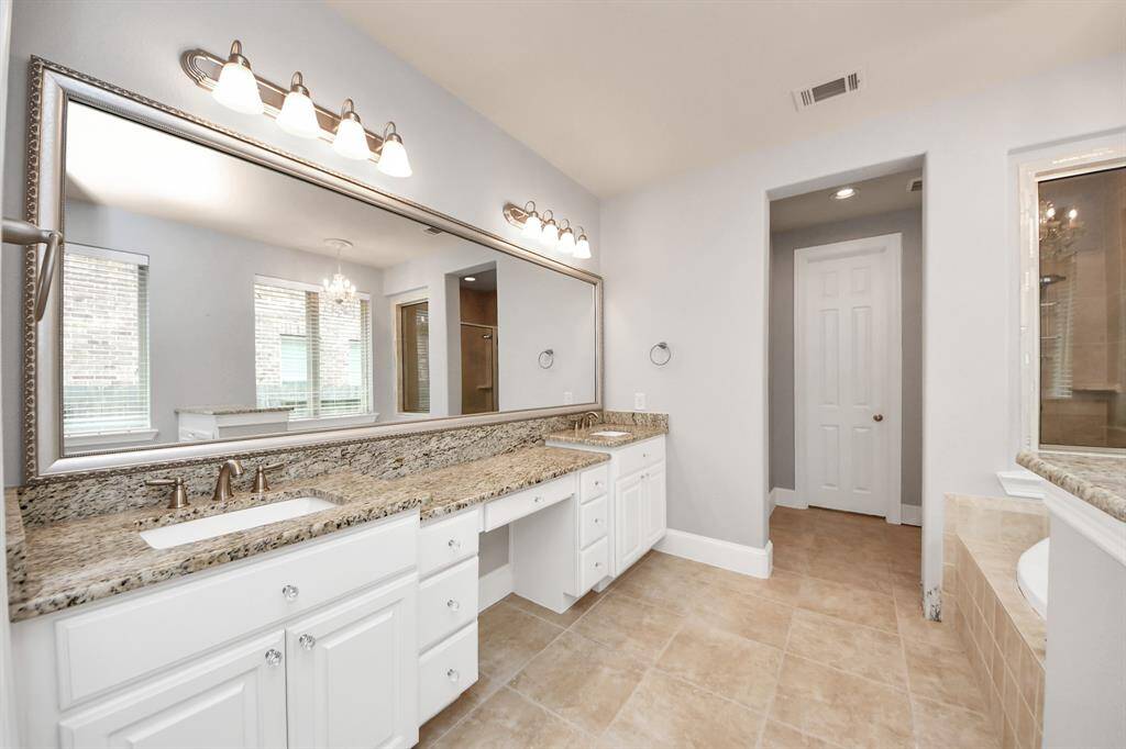 Primary bath with dual sinks and vanity