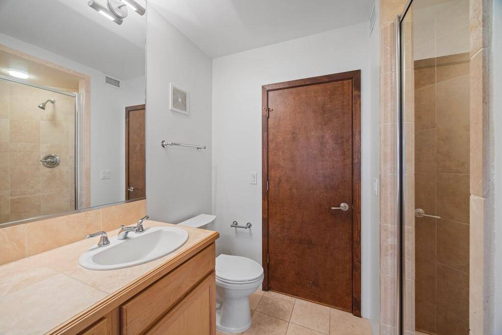 1st floor guest bathroom with a stand alone shower.