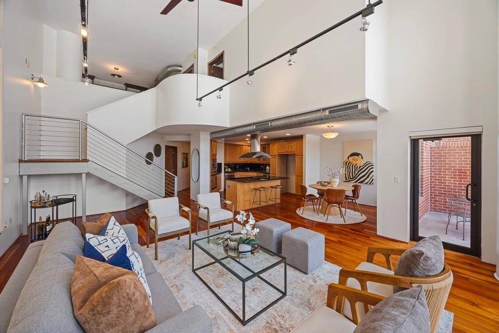 This 2-story loft is full of natural light. Great wall space for art lovers too.