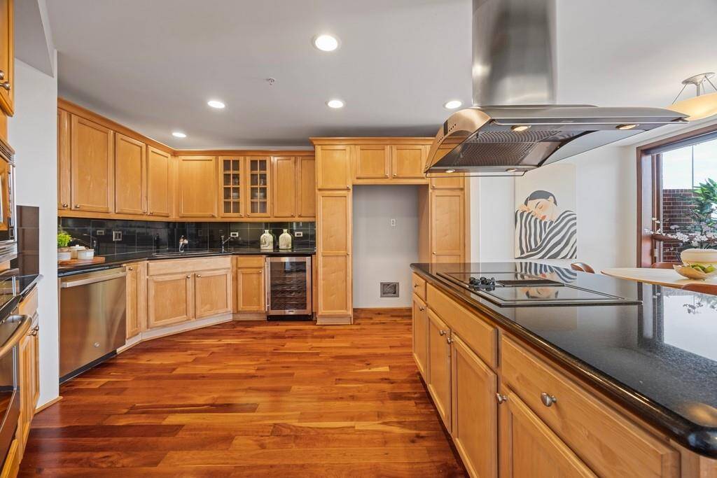 Kitchen includes a new dishwasher and a new wine refrigerator.
