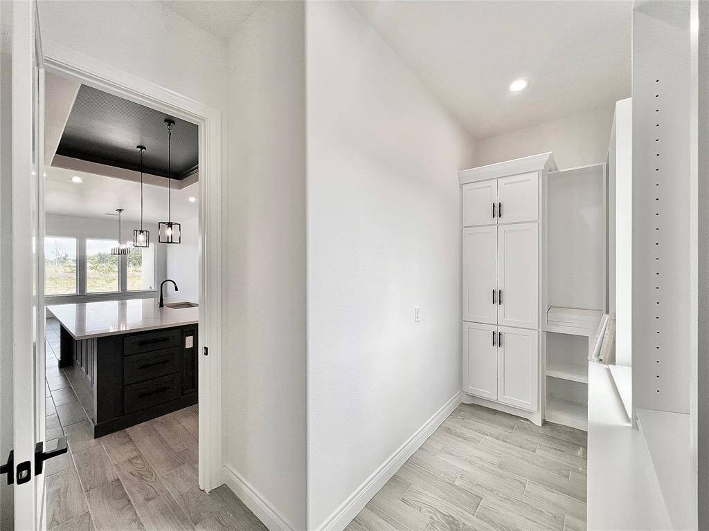 Walk-in Pantry Room with customizable shelf heights to accommodate any size appliance