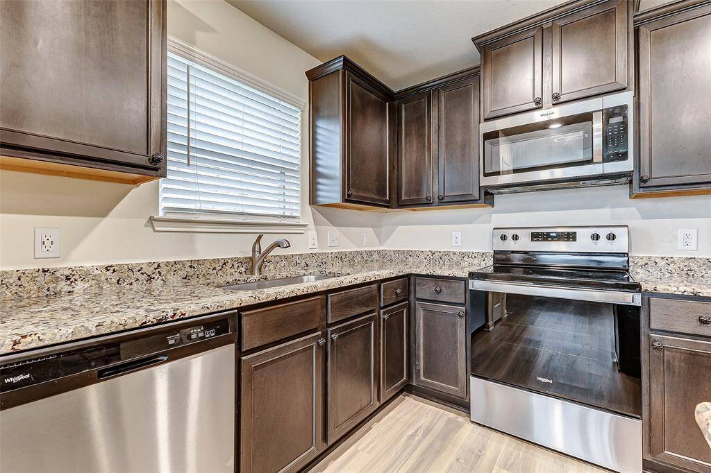 Stainless steel appliances complete this kitchen.