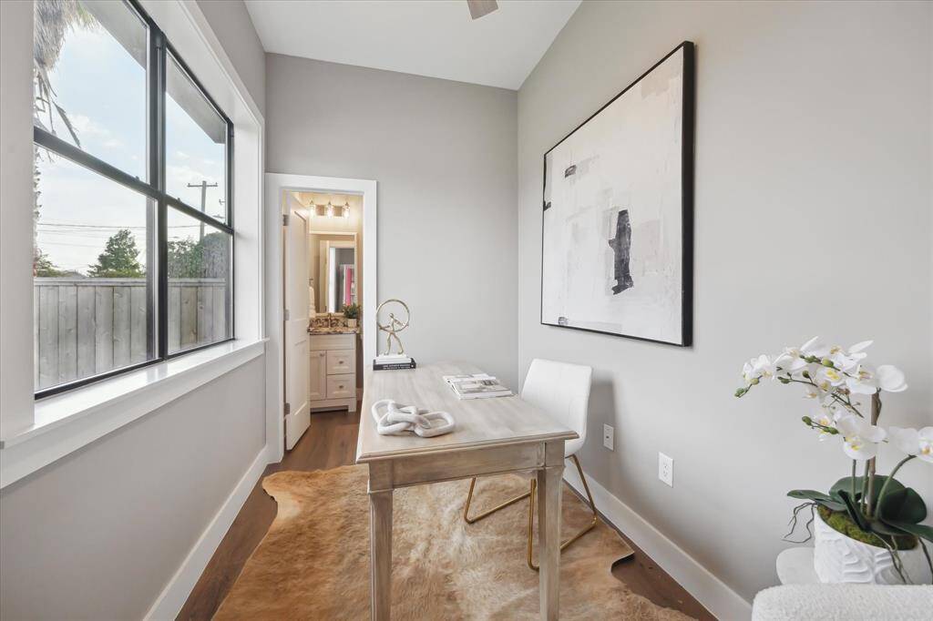 Tucked just off the entry, this light-filled room overlooks the front yard and offers endless versatility—home office, third bedroom, workout zone, or creative space—with a full en suite bath for added convenience.