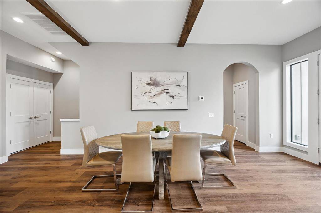 Generously sized for hosting, the dining area easily accommodates a full table setup—and just steps away, the double-door closet discreetly houses the in-unit laundry for everyday ease.
